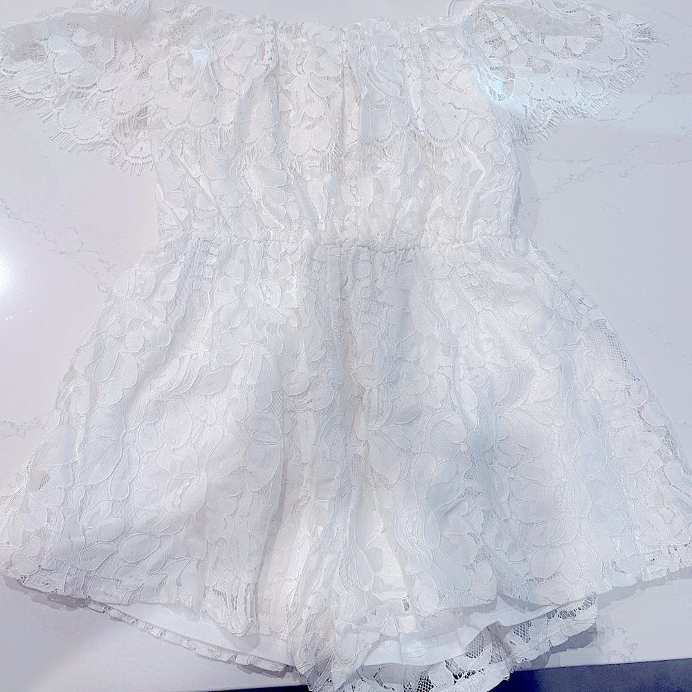 White medium night to remember romper from Bella and bloom. Worn once